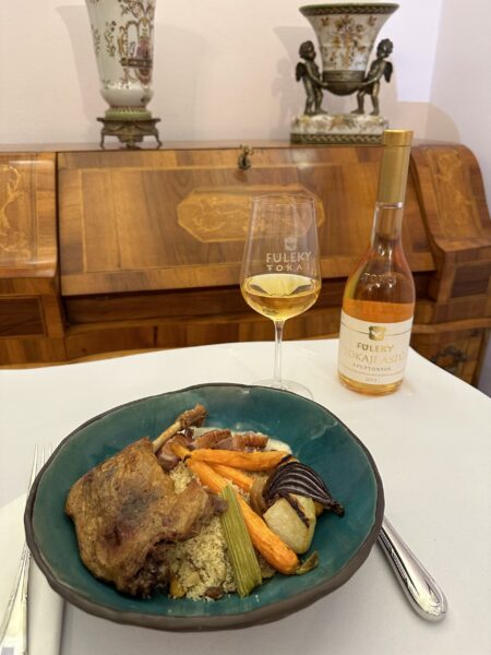 Duo of duck, couscous with sautéed dried fruits, oven roasted root vegetables